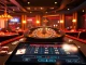 Play exciting games at nk88 casino featuring vibrant tables, roulette wheels, and luxurious atmosphere.